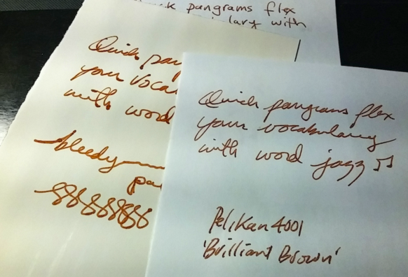 A few scrap paper ink tests area shown. Mostly cursive script with some scribbles.  

The passage used is one of my own pangrams - that is a sentence where all the letters of the alphabet are used.  It's a 43 character one reading "Quick pangrams flex your vocabulary with word jazz" 