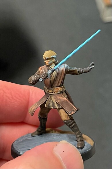 From the left side Anakin’s stance is more clear. The glow from his saber reflects from his shoulder. 
