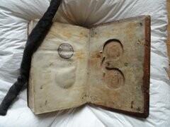 Eyeglasses' case carved out of the back board of a book from 1526. Bruges, Ten Duinen, Ms. 66/35. Loys van Boghem Hours, 1526.