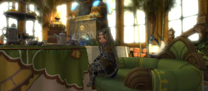 screenshot from the game Final Fantasy 14. Lalafell in credendum tank gear, sitting on a cozy green chair in a superbly decorated house.