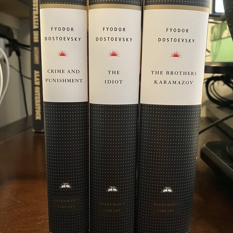 Book spines of ‘Crime and Punishment’, ‘The Idiot’, and ‘The Brothers Karamazov’ by Fyodor Dostoevsky