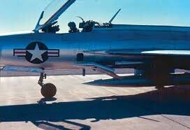 Close up of the cockpit and forward fuselage of a captured MiG-21 on the ground