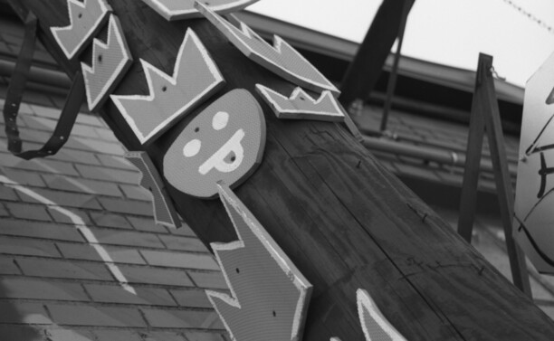 Street art affixed to a utility pole.