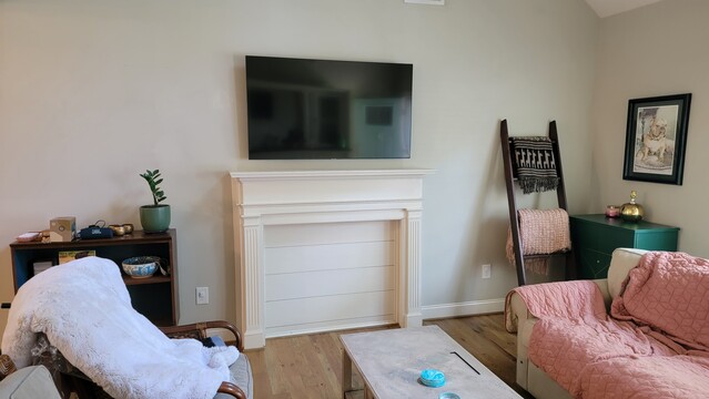 Today's TV install over a dummy fireplace.