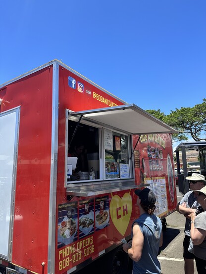 Picture of people standing in line at a food truck in Lahaina Hawaii on August 8th 2023. 
