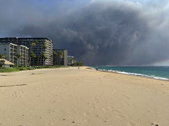 Smoke billowing over resorts on Kaanapali Beach in Maui