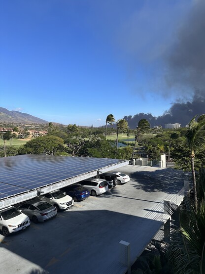 Thick black smoke rising from the hills of Lahaina Hawaii