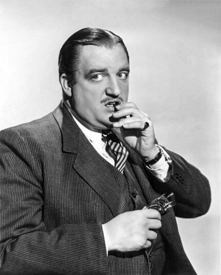 Lair Cregar looking suspicious while wearing a suit in the 1942 noir “This Gun for Hire”.