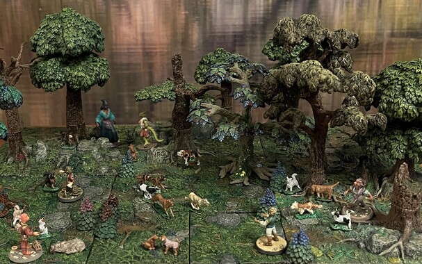 View of a miniature landscape with lush ground, trees, and blooming flowers. Many dogs are running, smelling, and generally enjoying the landscape, while their accompanying people, of various fantasy types, relax in the park.