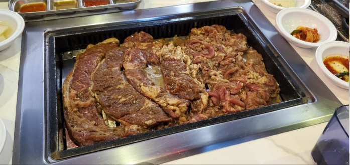 picture of meat on the grill, short rib and bulgogi
