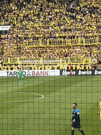 Borussia Dortmund ultra group The Unity hold a banner with the text: ‎״Justice for Mouhamed, rest in power! For an independent scrutiny of police!“