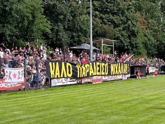 FC St. Pauli ultra group Ultra Sankt Pauli with a banner in memory of AEK Athens fan Michalis Katsouris, who was stabbed to death. 