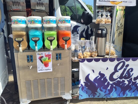 Self service slushy machine with brown, blue, green and orange slushy