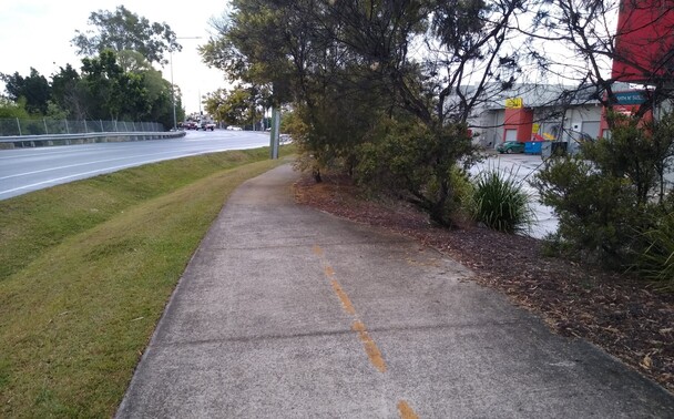 Photo of a reasonably wide shared path that ends and becomes a narrow footpath.