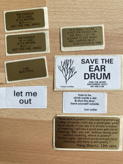 A set of stickers from Ivor Cutler including Save the eardrum, noise abatement society, I am beautiful, how to be and in a small room. 