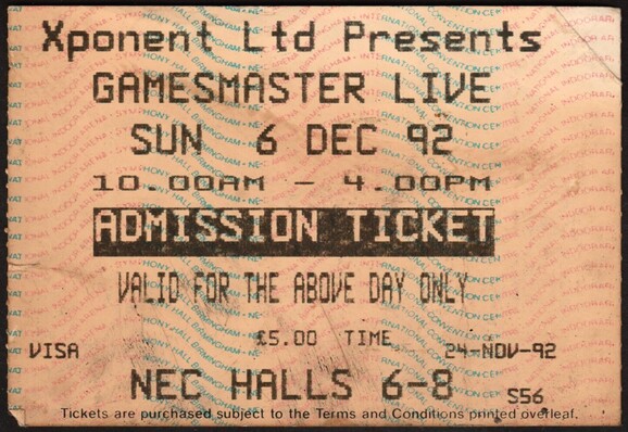 The ticket for the first Gamesmaster Live at the Birmingham National Exhibition Centre on 6 December 1992. Printed in black on a pale pink ticket with pink and blue wavy text as background.