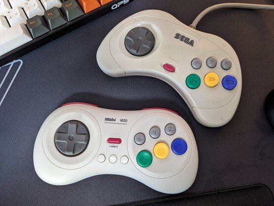 8bitdo M30 next to an actual Saturn controller