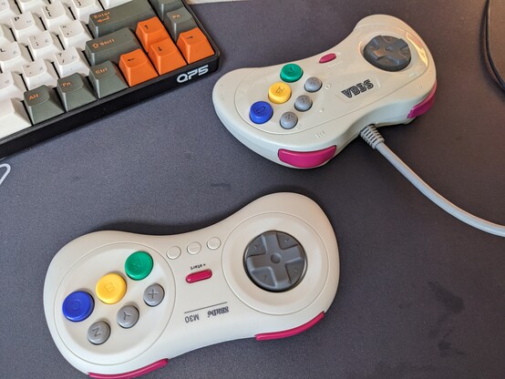 8bitdo M30 next to an actual Saturn controller