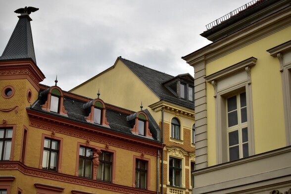 Rooftops, gables, cloudy sky
