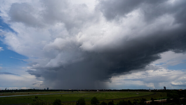 A raincloud looming in the distance behind Tempelhof airfield.