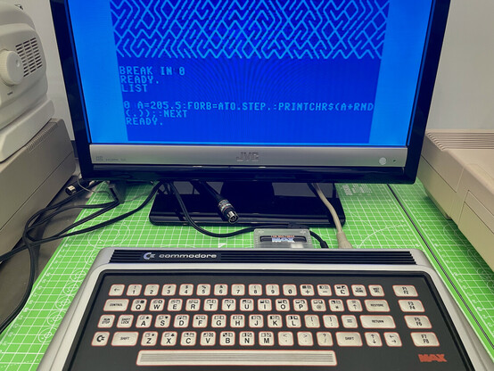 A Commodore Max Machine showing an optimised version of the classic "10 PRINT" demo which draws a random maze in a single line of BASIC code.