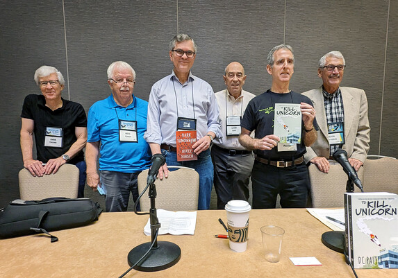 Mark Coggins, Ross Carley, Reece Hirsch, Larry Light, DC Palter, Delvin Chatterson before their panel on technology in mysteries at the 2023 Bouchercon in San Diego.