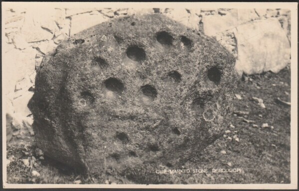 "This stone is a comparatively recent discovery. Face downward it formed the doorstep of an old stable, and the cups became visible only when it had to be lifted in order that a drain below the stable might be cleared. The Gaelic name of the place means "Sunday Well." There is a holy well 30 yards to the south. Tobairandoinaich, or, to be exact, Easter Tobairandonaich, is a ruined village with the remains of two farm-steadings and many dwellings on the hillside above the mansion-house of Dercul…