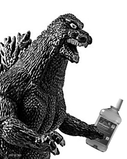Godzilla holding a bottle of mouthwash
