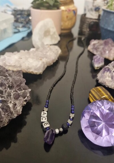 Handmade beaded necklace with silver ACE letters and amethyst gemstone