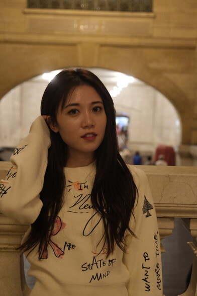 portrait of girl in white top in marble train station hall, GCT