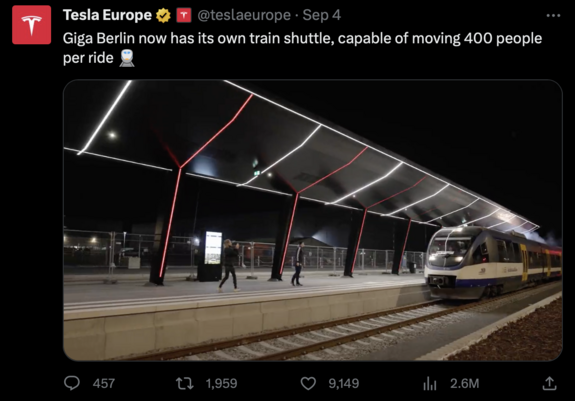 Screenshot of Tesla Europe tweet "Giga Berlin now has its own train shuttle, capable of moving 400 people per ride" with a video of the train