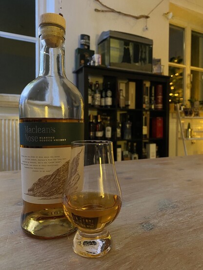 Bottle of Whisky and a Dram on my living room table. 
