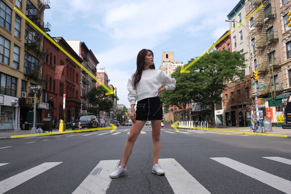girl standing in street, with lines shown