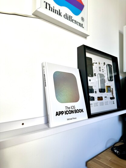 A photo of the iOS App Icon Book standing on a shelf