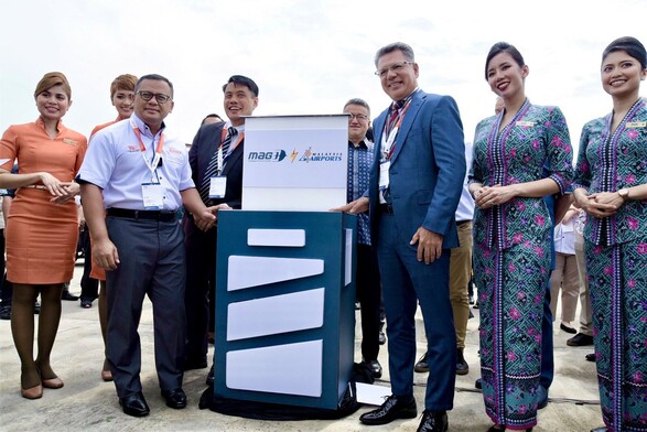 A group of people officiate the launch of a programme.