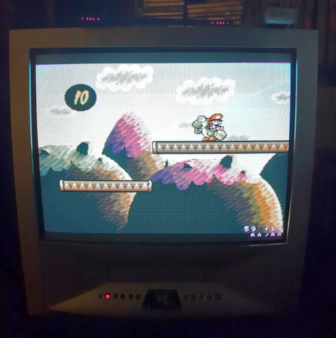 A CRT TV showing Yoshi's Island emulated on a Nintendo Wii