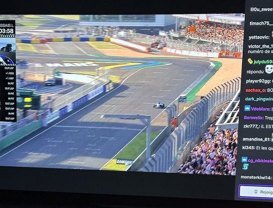 Photo of TV screen showing a Formula 4 car on a circuit where Le Mans is written on the ground