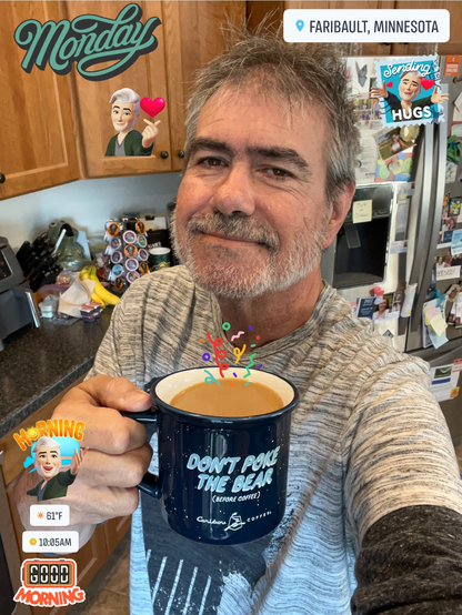 JR is holding a cup of coffee in a morning selfie 