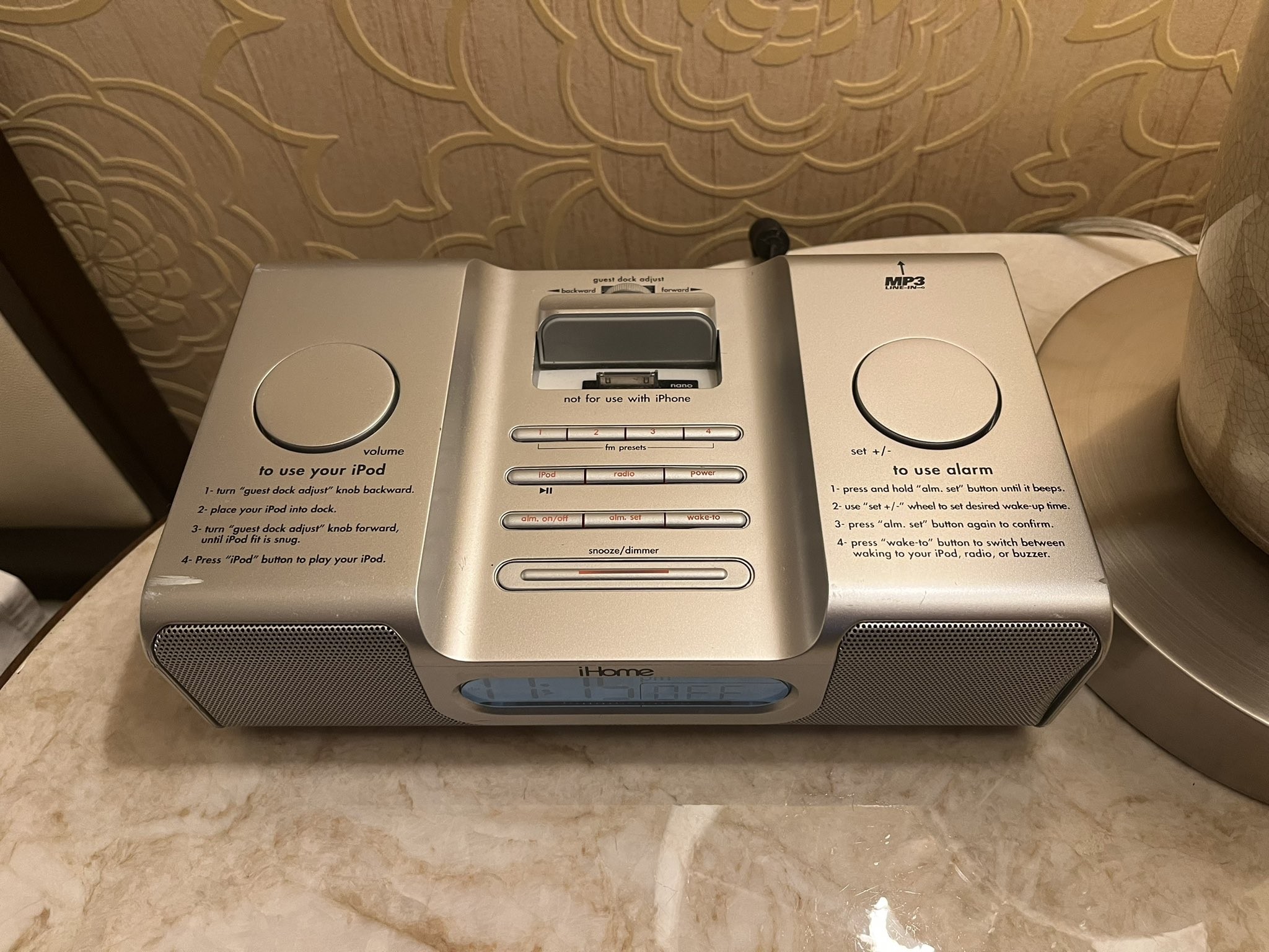 Photo of a hotel clock radio with an empty iPod dock