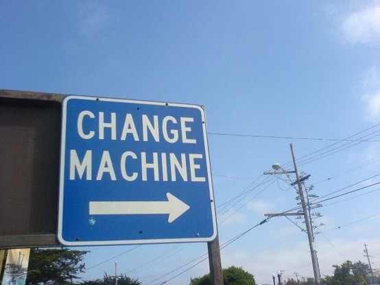 personal change is easy: a photograph of an outdoor sign that says "CHANGE MACHINE" with a directional arrow