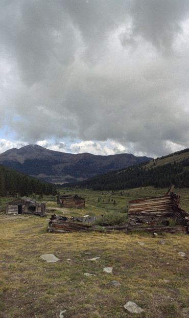 Abandoned mining encampment in a mountainous environment