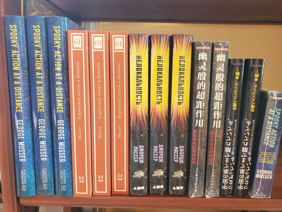 Bookshelf with copies of “Spooky Action at a Distance” in multiple languages