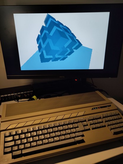Atari Falcon/060 runs a 3D effect with blue cubes written in Free Pascal.