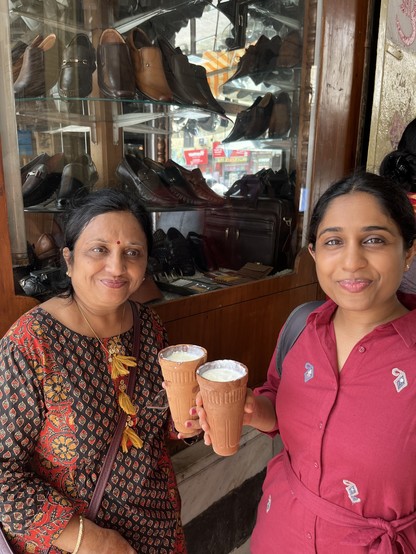Ruchika and her mother with big khulads of lassi with big smiles. Notice Ruchika had a slight lassi moustache.