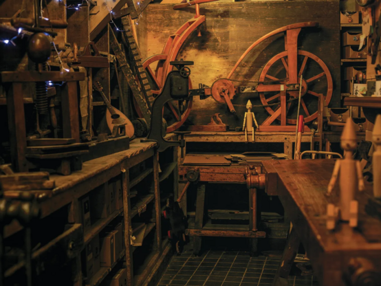 Bartolucci’s shop in Florence.
Simona Ghizzoni

A picture depicting a woodworking atelier. It has many wood instruments, musical instruments, desks and 3 wooden Pinocchio figurines.