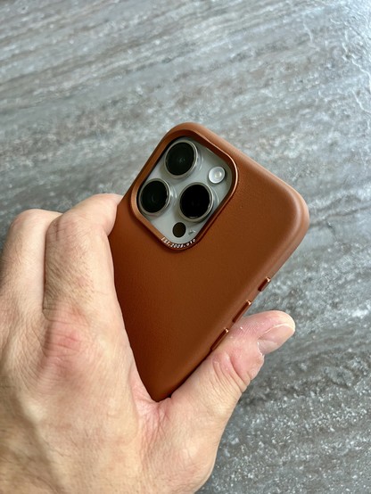 iPhone 15 Pro in brown leather case from Decoded. 