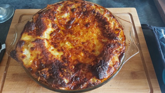 Dish of lasagne with the obligatory burnt crispy bits on the top