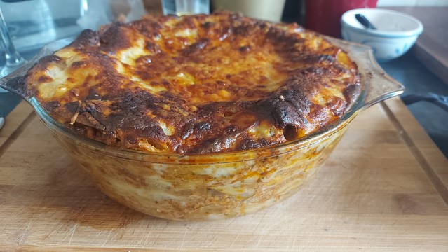 Dish of lasagne with the obligatory burnt crispy bits on the top