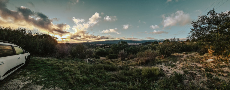 Panoramaphoto with view to south from in hill. A village to the feed an in the background the Pyrenees in the morning light.