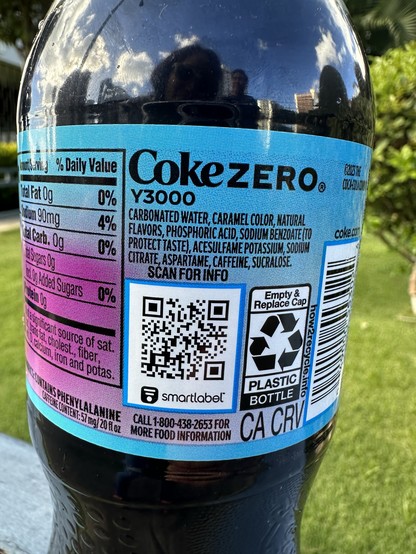 The back label of the Coke Zero Y3000 showing ingredients and a QR code.